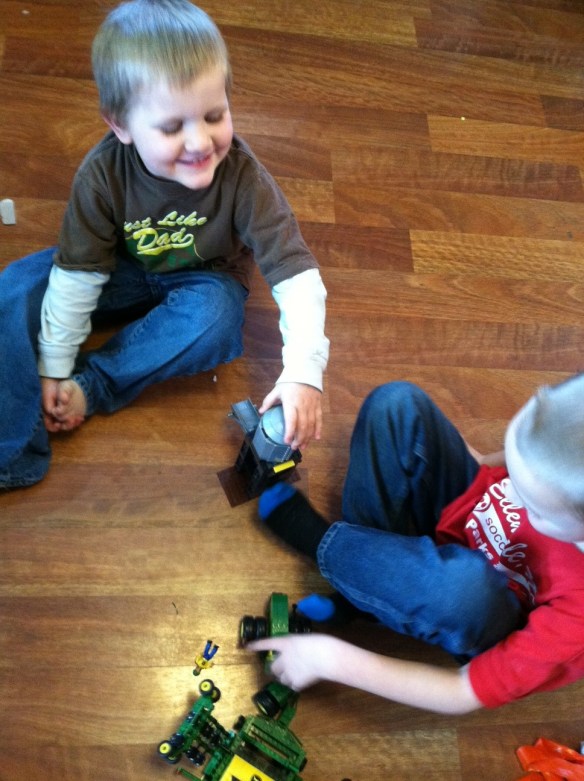 EJ was making sure that George wasn't sharing any secret farmer information while Mom was taking photos. Priceless moments.